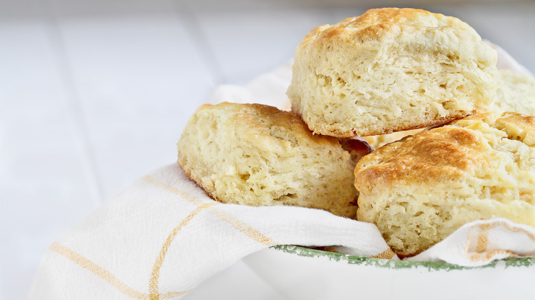 biscuits layered in bowl with cloth