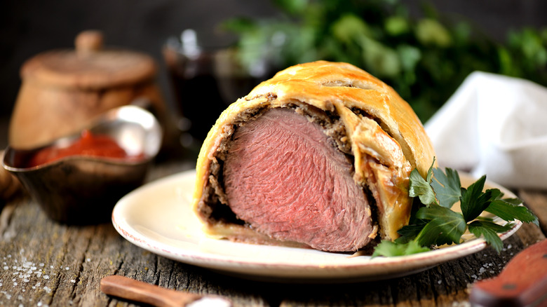 Beef Wellington on wooden table