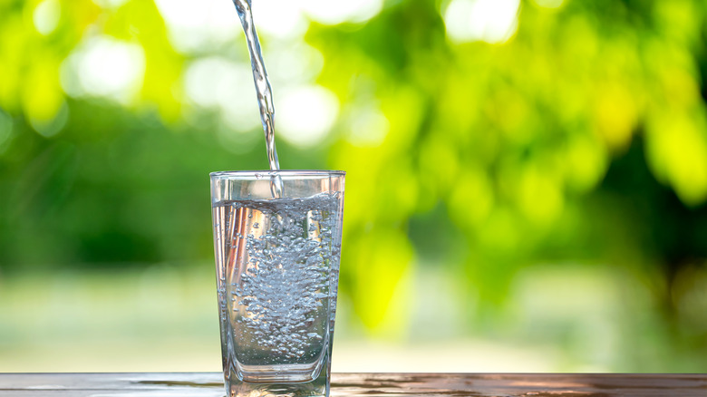 Water flows into a glass