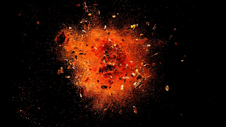 Cayenne pepper powder on background