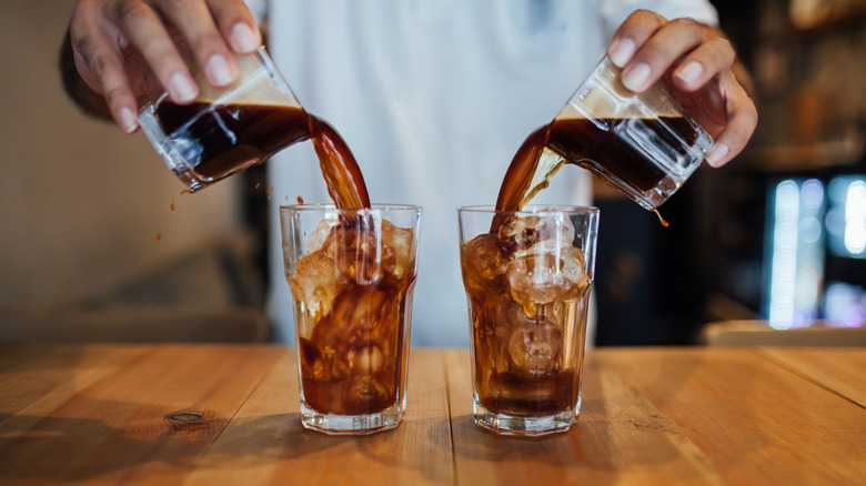 Man pouring cold brew coffee