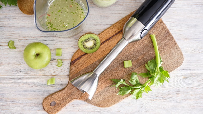 immersion blender on wooden board