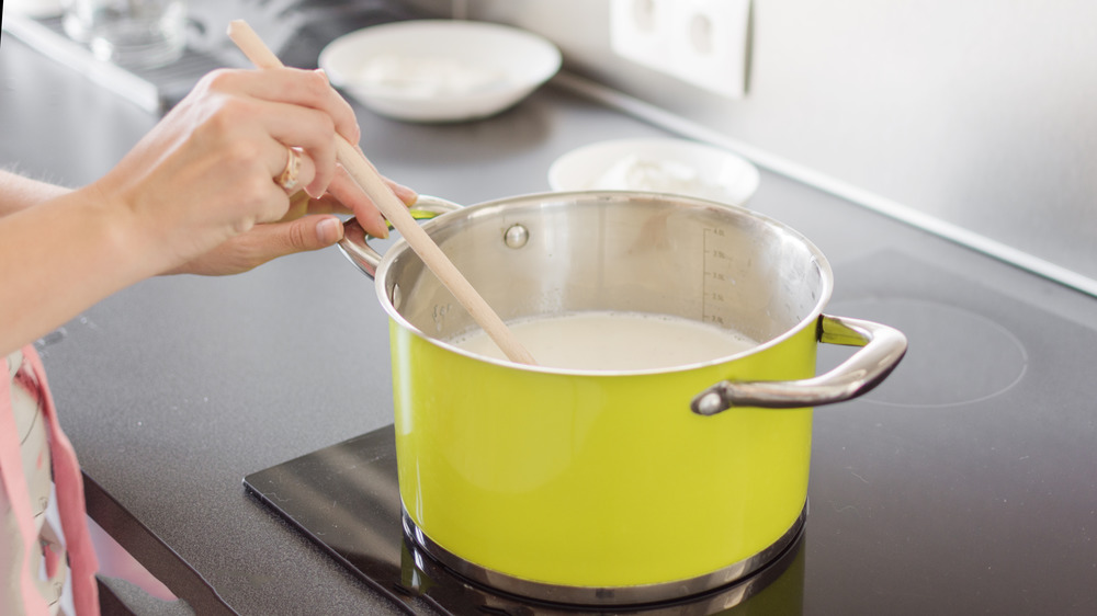 making bechamel sauce in a lemon colored pot