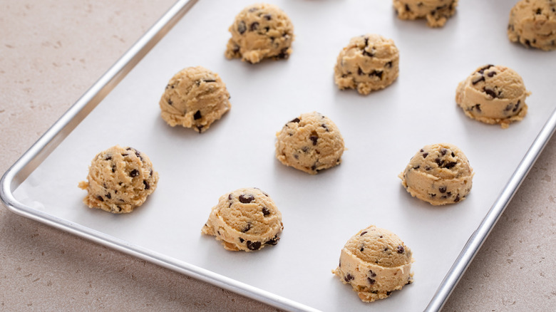 Chocolate chip cookie dough on baking sheet