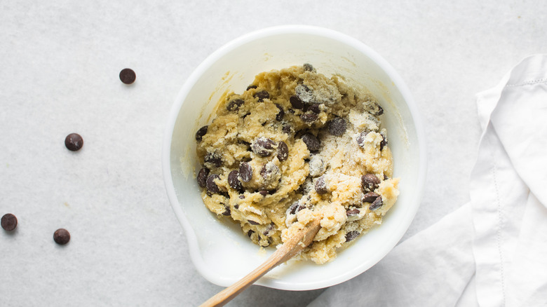 Chocolate chip cookie dough in mixing bowl