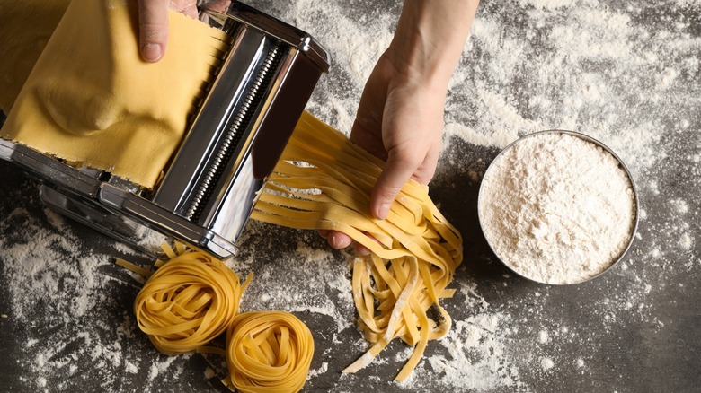 Pasta sheet getting cut into strands