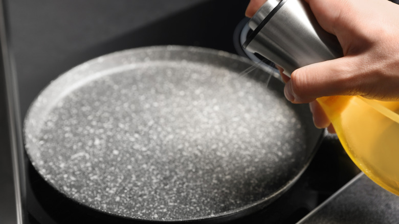 cooking spray being spray on pan