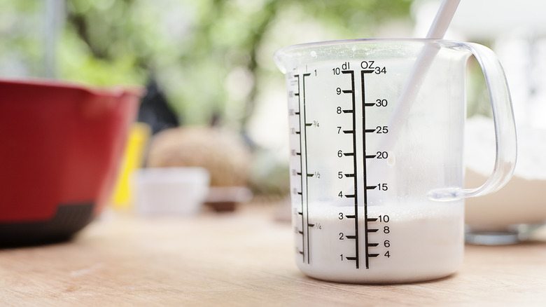 Milk in measuring jug