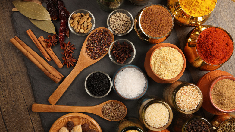 Small bowls of herbs and spices