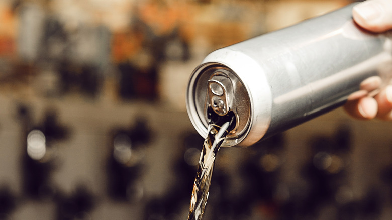 Beer being poured from can
