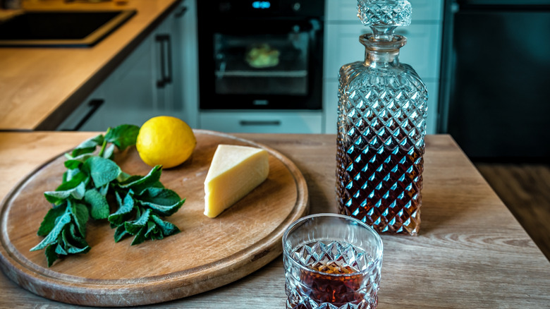 Decanter and glass of bourbon in kitchen