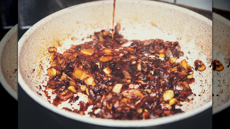 Alcohol pouring into pan