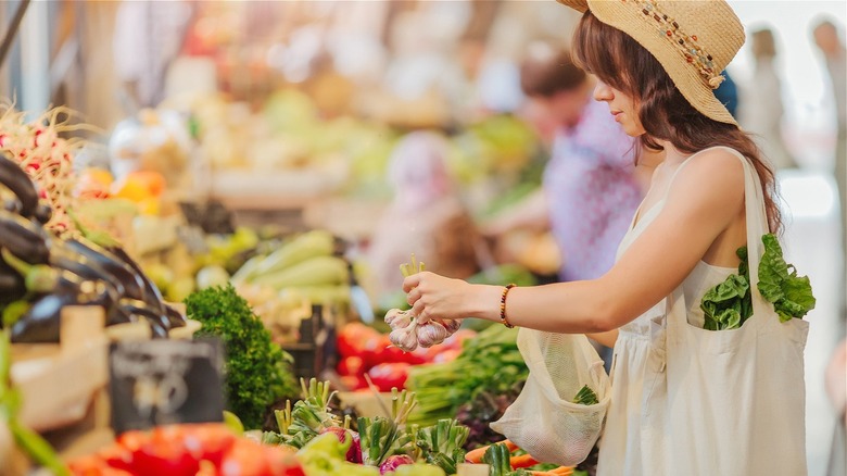 woman shopping farmers market 