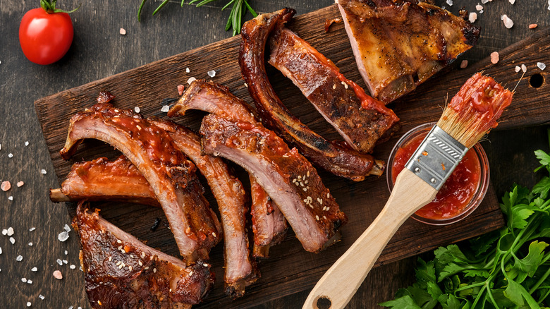 sliced ribs on wooden board