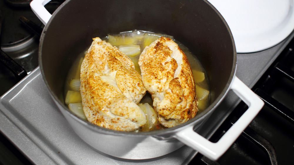 Chicken braising in a pot