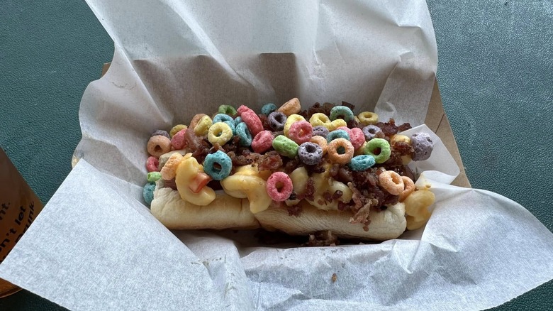 A Slider Dog at Progressive Field covered in colored cereal