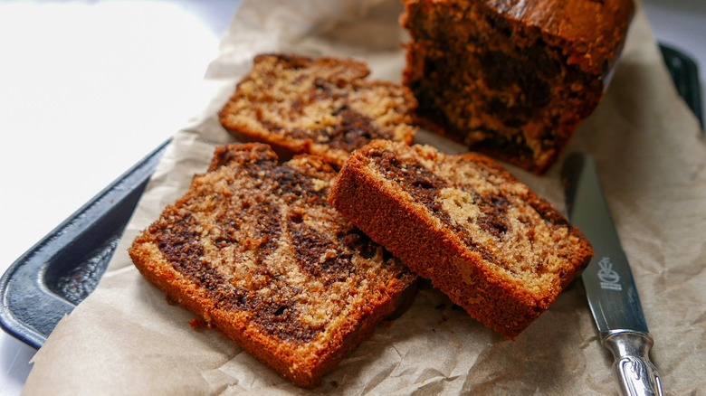 Sliced marble pound cake on a serving board