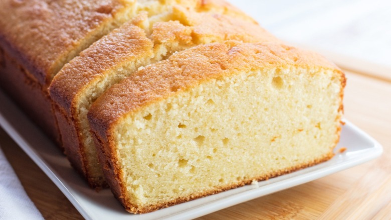 moist pound cake, sliced on a plate