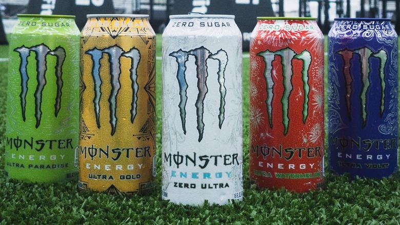 five Monster Energy drink cans