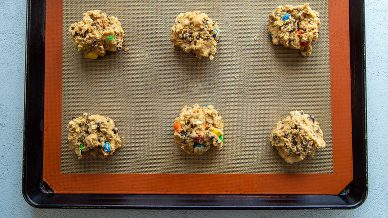monster cookies on baking sheet