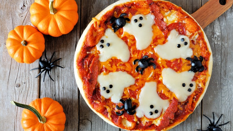 Halloween pizza with ghosts and spiders