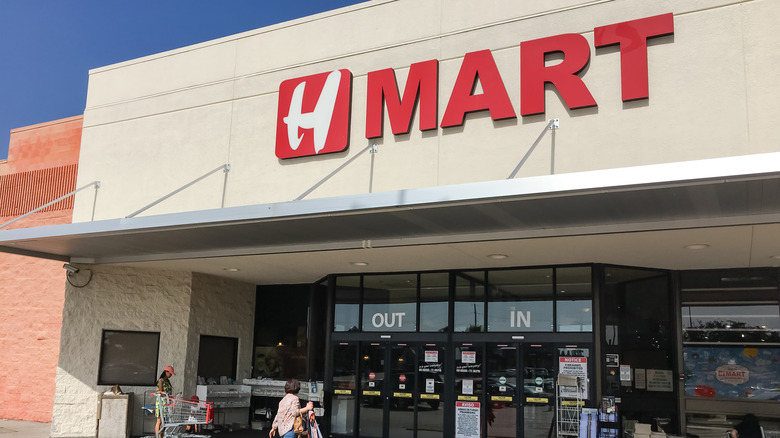 H Mart storefront with customers entering