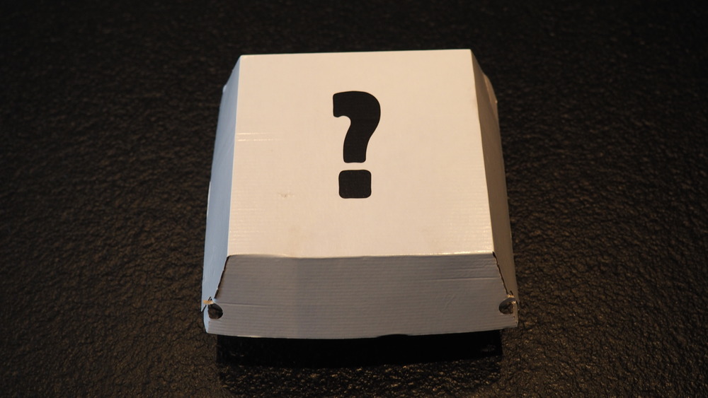 A burger box adorned with a question mark