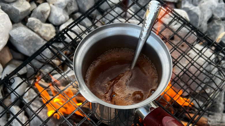 Boiling coffee on an open flame