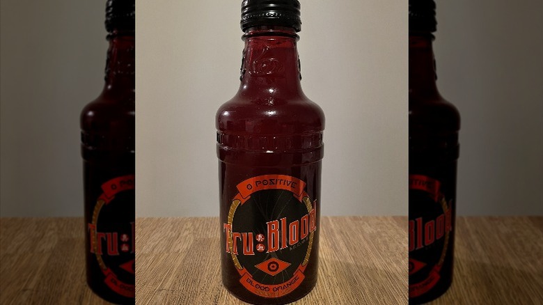 Bottle of Tru Blood on wooden surface