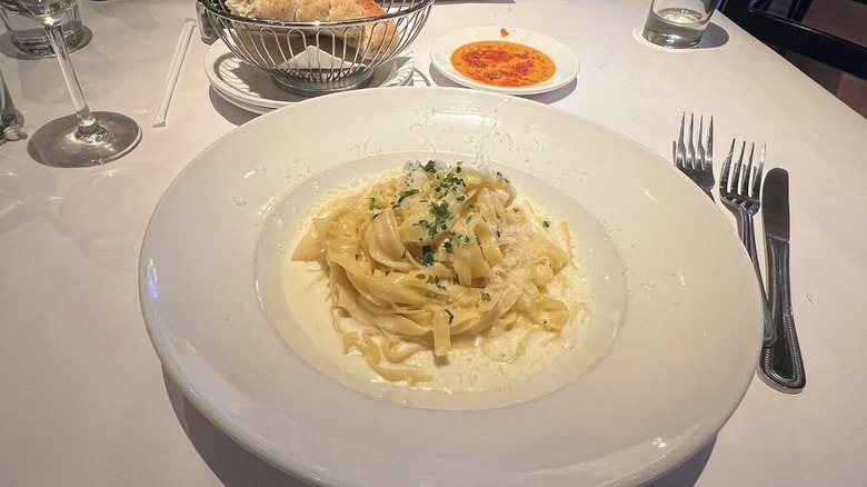 Fettuccine Alfredo from Bravo's Italian Kitchen in a white bowl on a white tablecloth