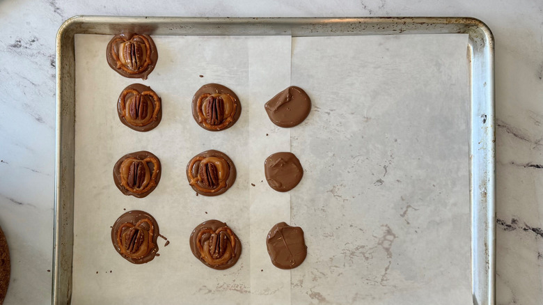 Chocolate turtles on baking sheet