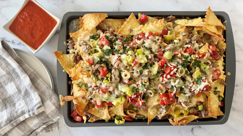 Platter of Italian nachos with side of marinara sauce