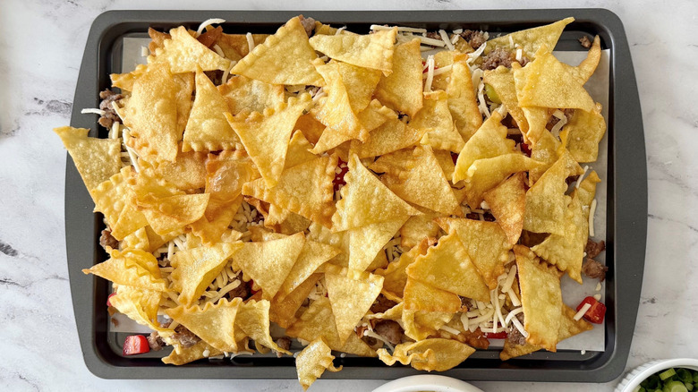 Italian nachos with layer of lasagna chips on top