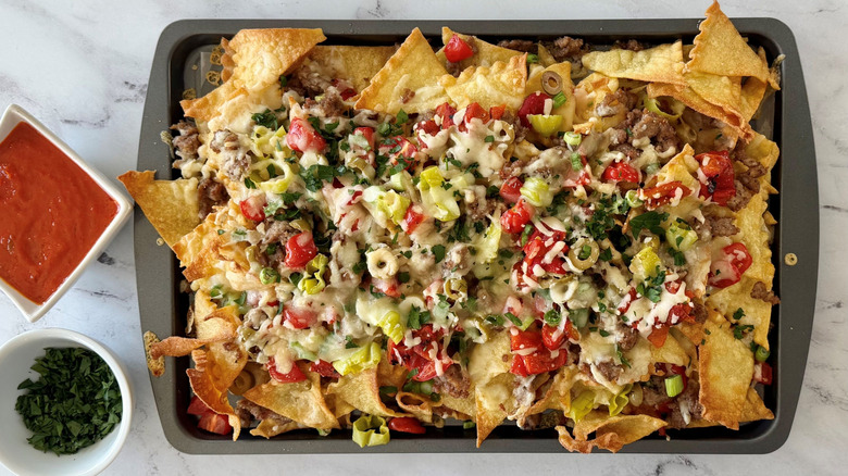 Italian nachos with marinara sauce and parsley