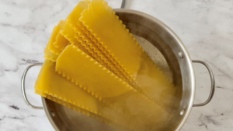 Lasagna noodles in pot of water