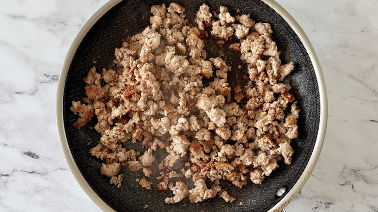 Cooked Italian sausage in pan