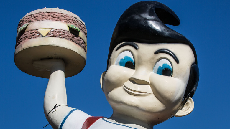 Big Boy cartoon sculpture holding a hamburger