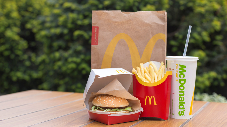 McDonald's burger, fries, drink, and paper bag