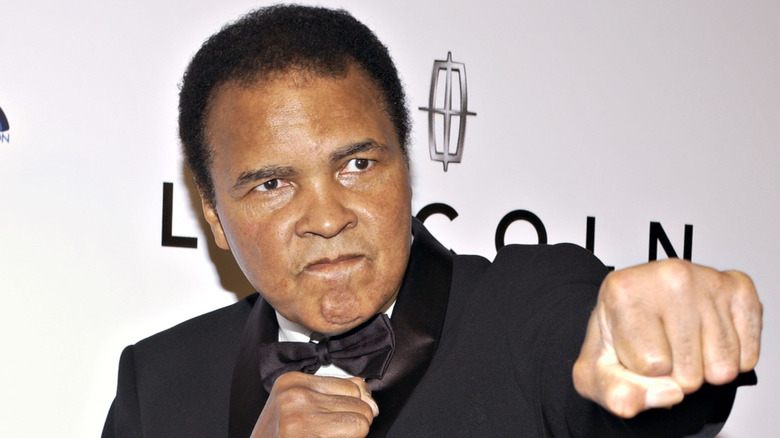 Muhammad Ali pointing his fist toward the camera