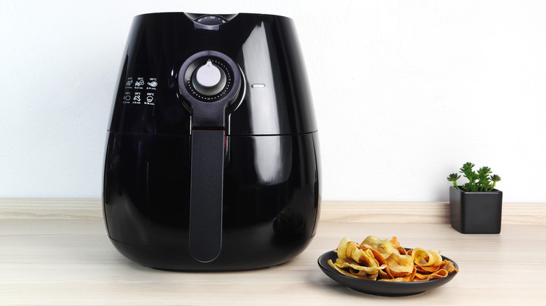 air fryer and vegetable chips on a plate