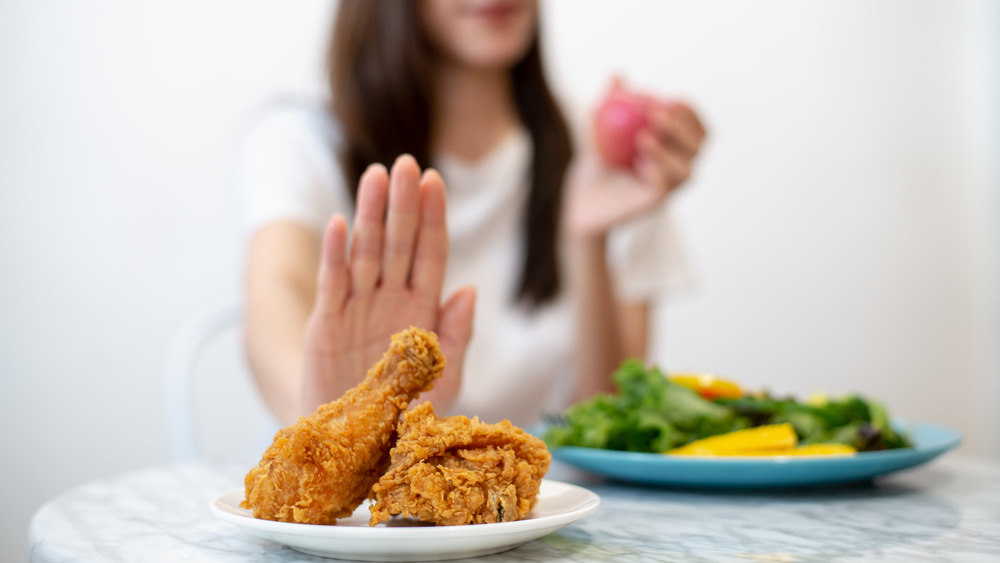 Woman saying no to chicken