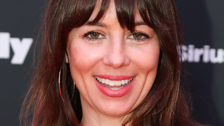 Natasha Leggero smiling for press