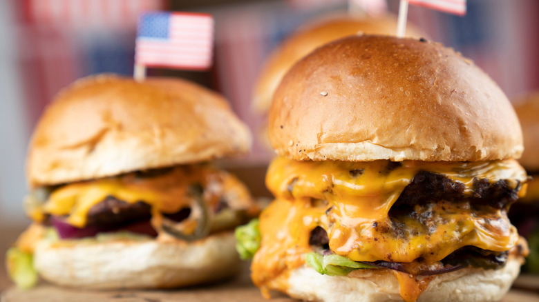 Two hamburgers topped with flags