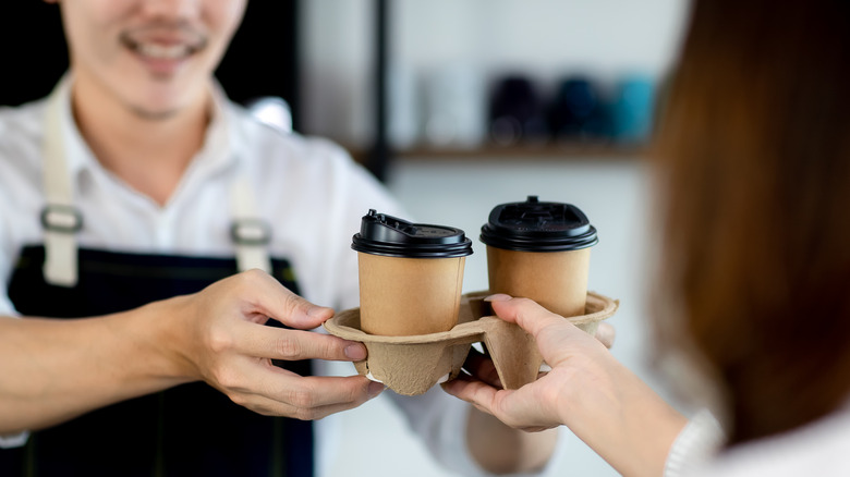 Paper coffee cups in tray