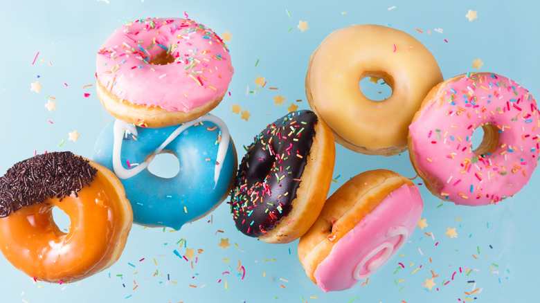 Pretty-colored doughnuts in the air like confetti