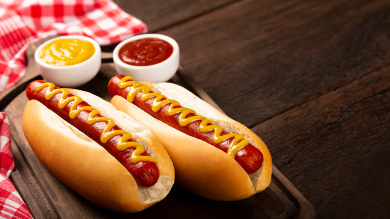 hot dogs in buns with mustard and ketchup