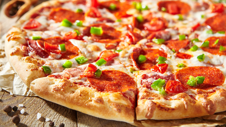 Pizza on a brown wood table