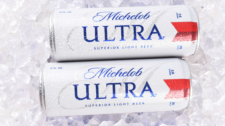 two cans of Michelob Ultra beer over ice