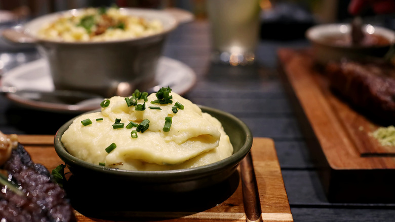 A bowl of mashed potatoes at a steakhouse