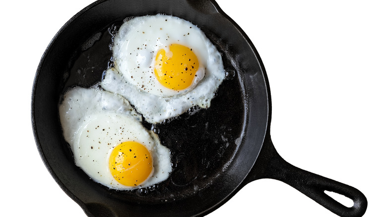 Cast iron pan of fried eggs